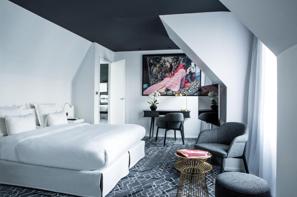 Postel nebo postele na pokoji v ubytování Le Général Hôtel