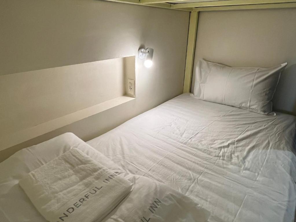 Postel nebo postele na pokoji v ubytování Wonderful inn 1