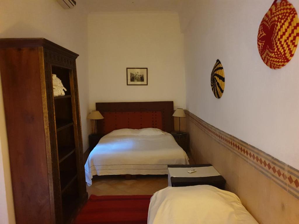 Postel nebo postele na pokoji v ubytování Riad Karmela