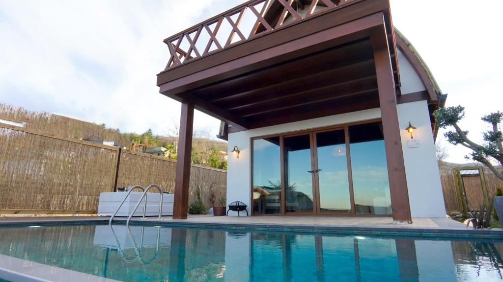 a house with a swimming pool with a pavilion at Exclusive Hill Sapanca in Sapanca