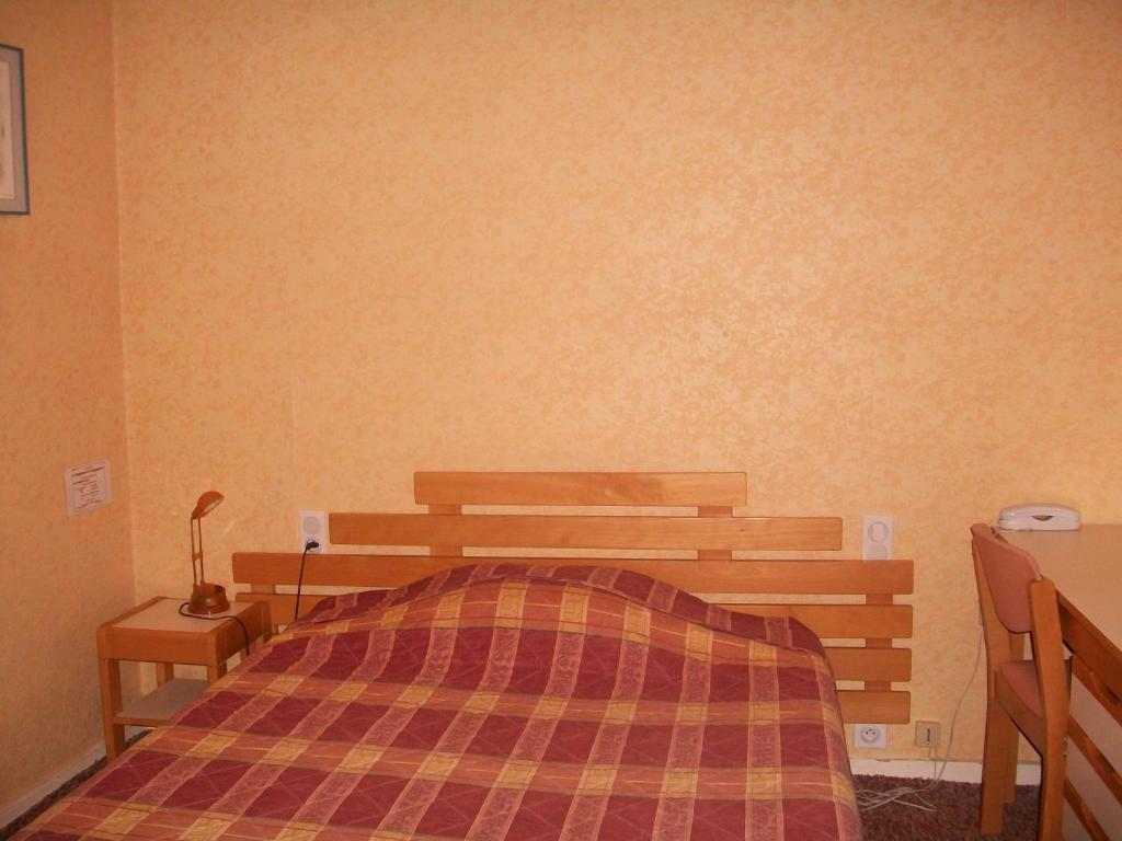 Postel nebo postele na pokoji v ubytování Hotel L'Aiglon