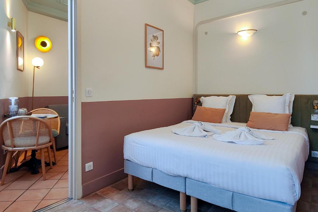 a bedroom with a bed in a room at Aparthotel AMMI Vieux Nice in Nice