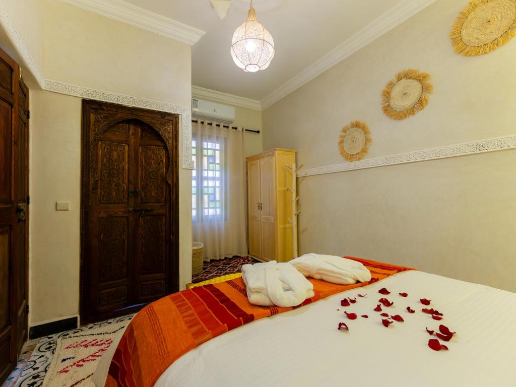 Postel nebo postele na pokoji v ubytování Riad Dar Lamia