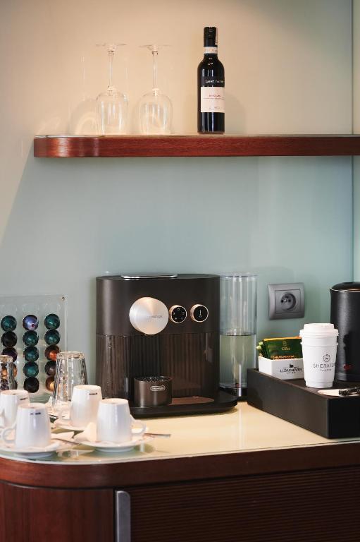 a kitchen with a coffee maker on a counter at Sheraton Sopot Hotel in Sopot