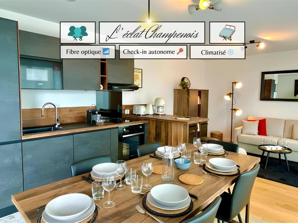 a dining room with a table and a kitchen at L'Éclat Champenois - Terrasse-Gare-Arena in Reims