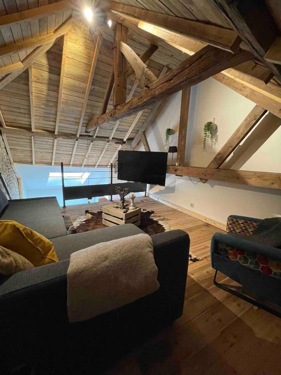 Posezení v ubytování Loft cosy, bain à bulle et garage privé