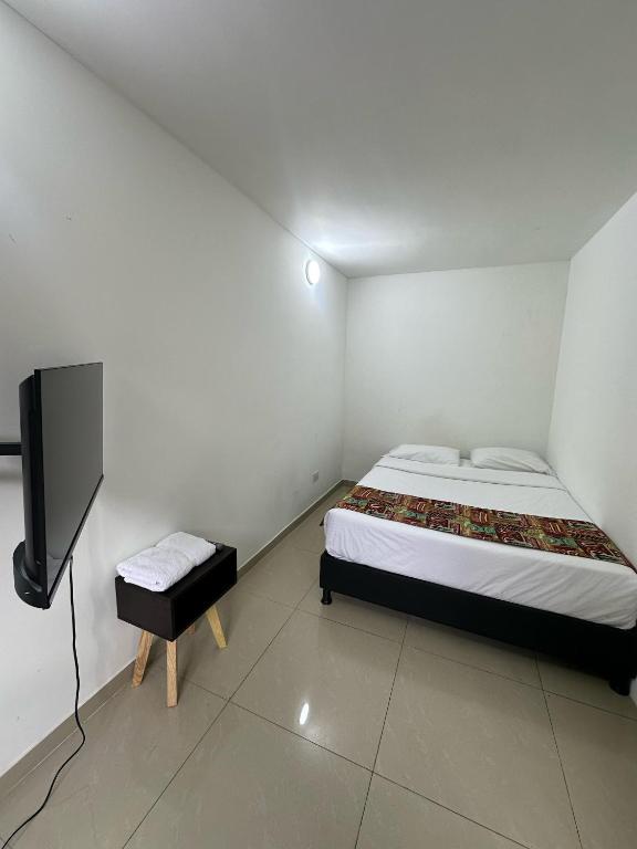 Postel nebo postele na pokoji v ubytování Bamuka Hostal