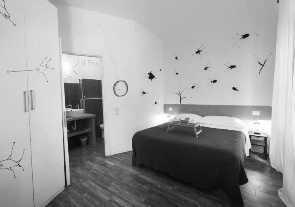 Postel nebo postele na pokoji v ubytování Boutique Hotel Novecento
