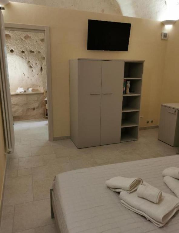 Postel nebo postele na pokoji v ubytování Radici Cave & Suite
