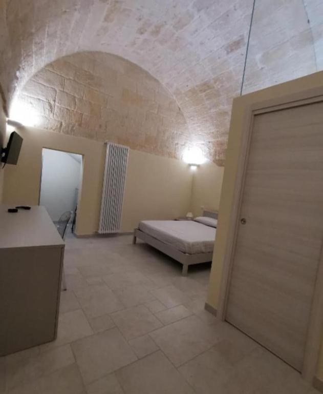 Postel nebo postele na pokoji v ubytování Radici Cave & Suite