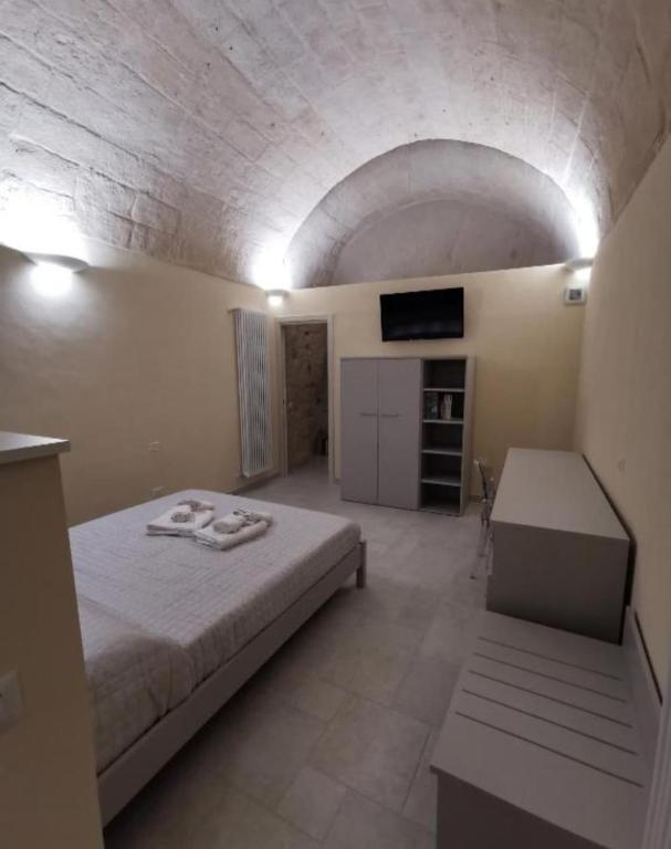 Postel nebo postele na pokoji v ubytování Radici Cave & Suite