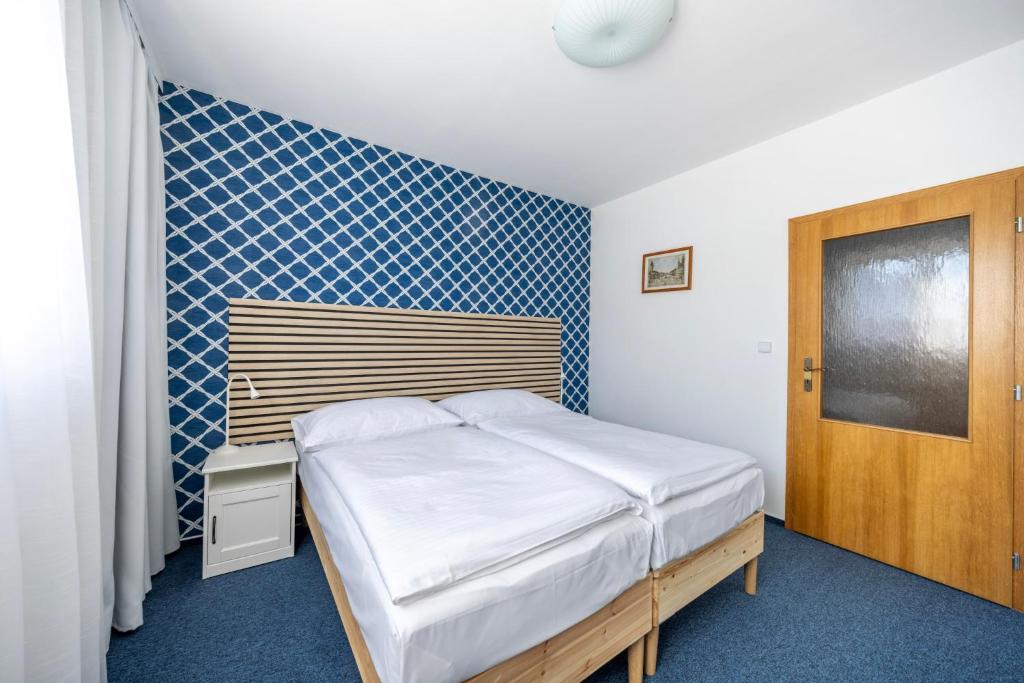 Postel nebo postele na pokoji v ubytování Marina Vltava