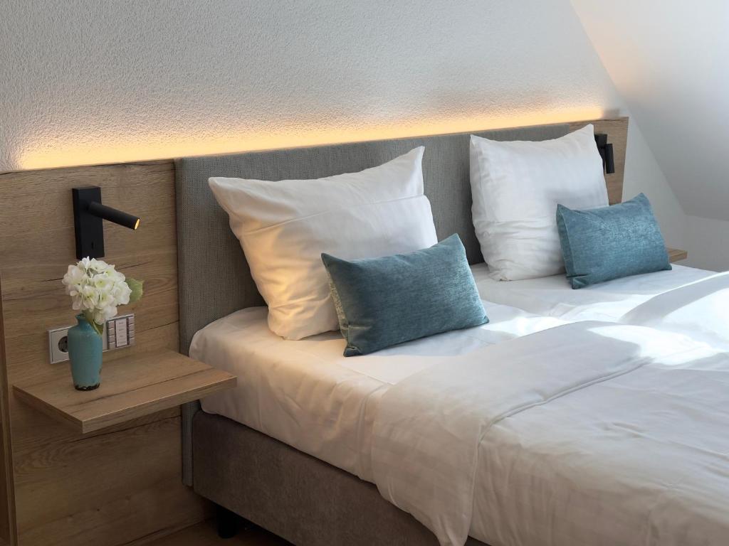 Postel nebo postele na pokoji v ubytování Living & Serviced Apartments by Blauer Wolf