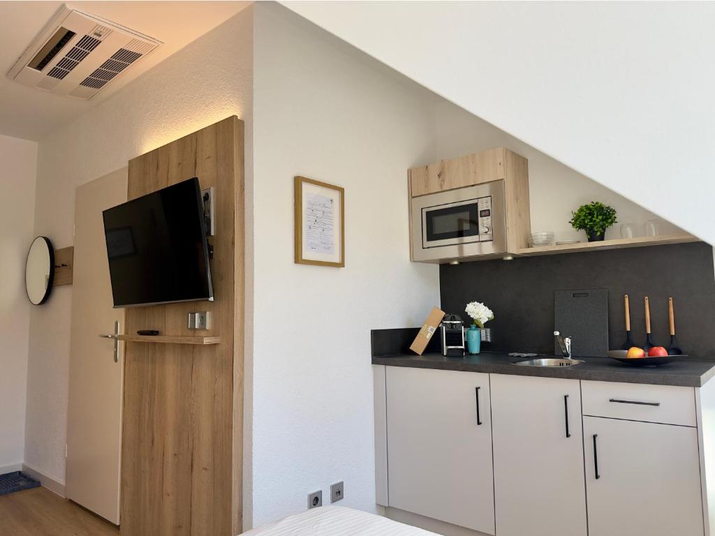 Kuchyň nebo kuchyňský kout v ubytování Living & Serviced Apartments by Blauer Wolf