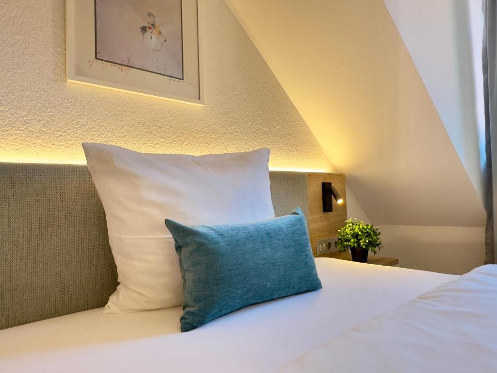 Postel nebo postele na pokoji v ubytování Living & Serviced Apartments by Blauer Wolf