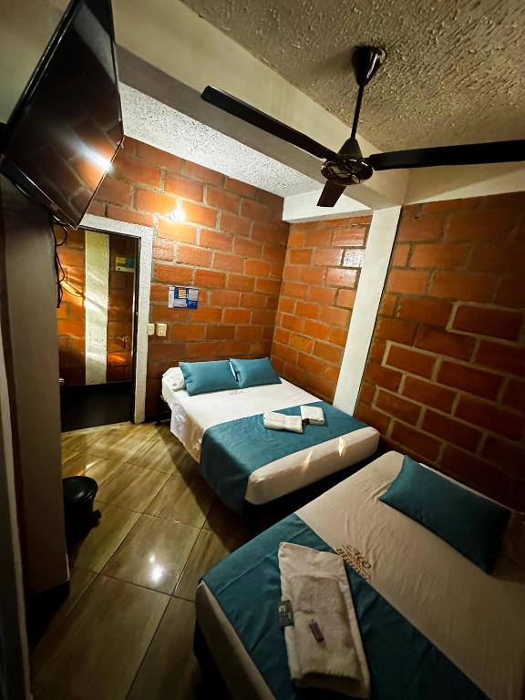 Postel nebo postele na pokoji v ubytování Hotel Mawill