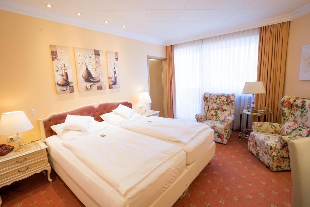 Postel nebo postele na pokoji v ubytování Hotel Modena