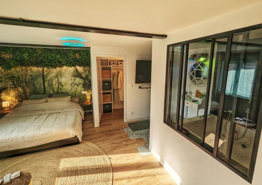 Postel nebo postele na pokoji v ubytování Gîte Oasis Ault - Ciné, Balnéo & Confort à la Mer