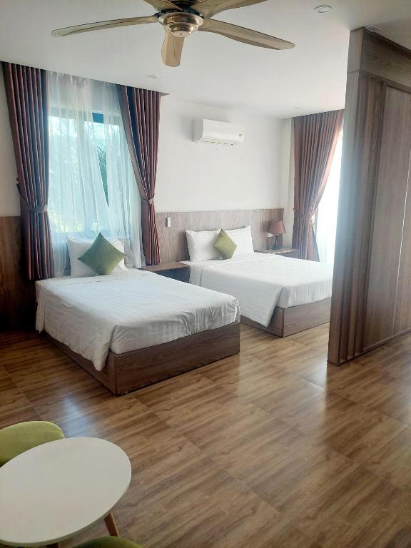 Postel nebo postele na pokoji v ubytování An Villa Beach Paradise