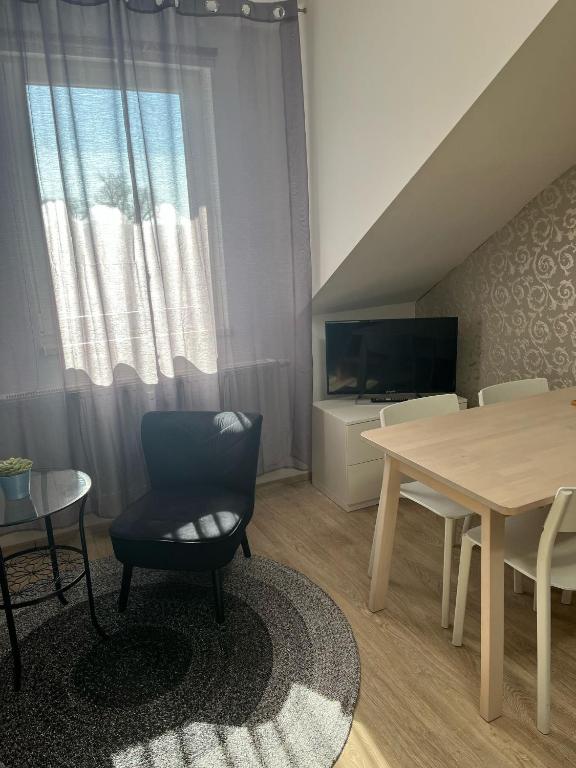 TV a/nebo společenská místnost v ubytování Apartmán Emmi