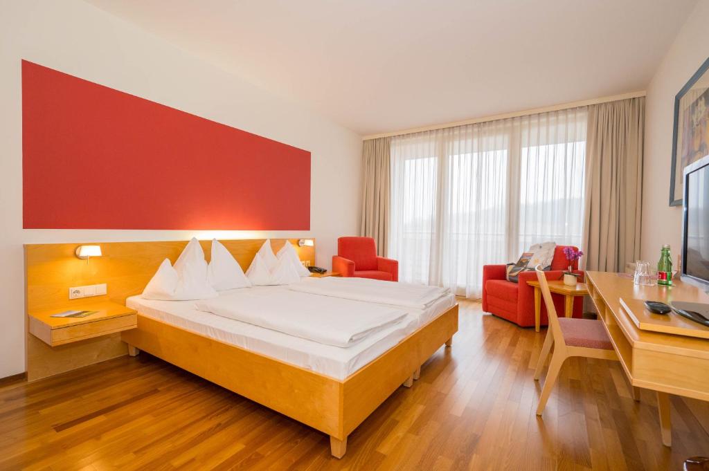 Ein Bett oder Betten in einem Zimmer der Unterkunft Allegria Resort Stegersbach - Allegria Hotel