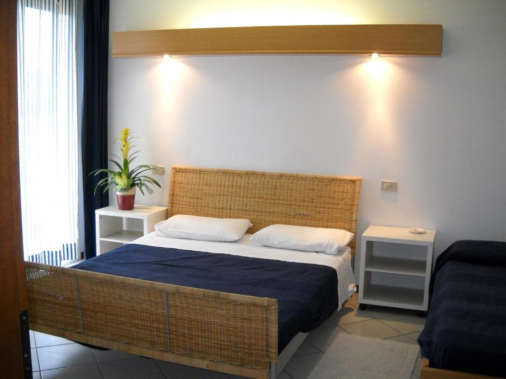 Postel nebo postele na pokoji v ubytování Hotel Rosmary
