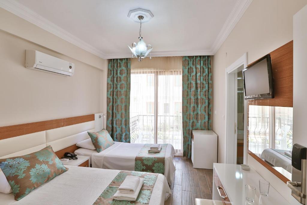 Телевизор и/или развлекательный центр в Hotel Kayahan