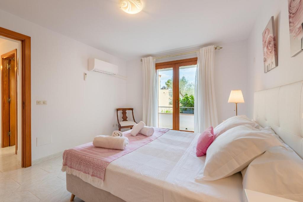 Postel nebo postele na pokoji v ubytování Villa Garrido