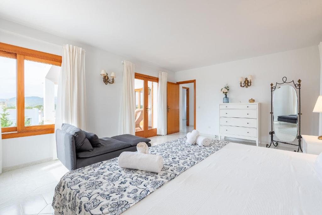 Postel nebo postele na pokoji v ubytování Villa Garrido