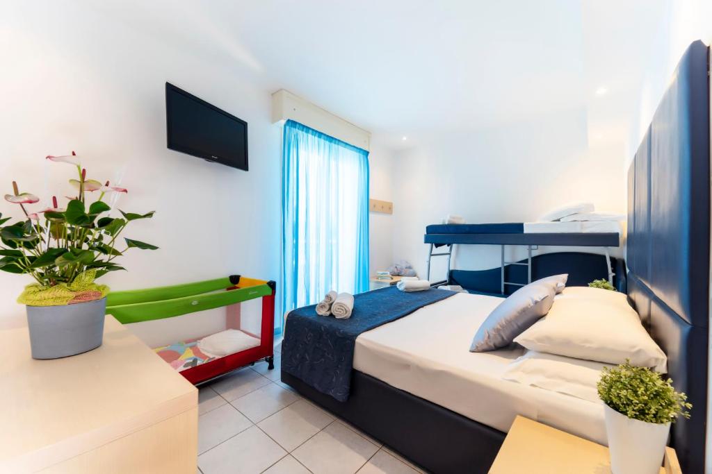 Postel nebo postele na pokoji v ubytování Baby Family Hotel Alda Amelia