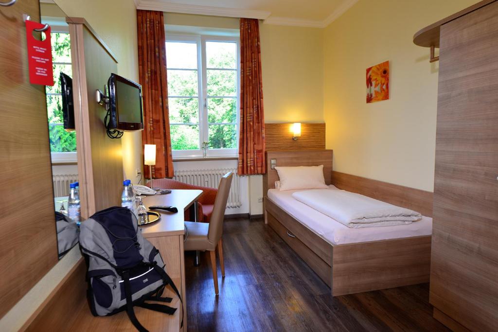 Postel nebo postele na pokoji v ubytování Haus Neugebauer-Gästehaus Garni
