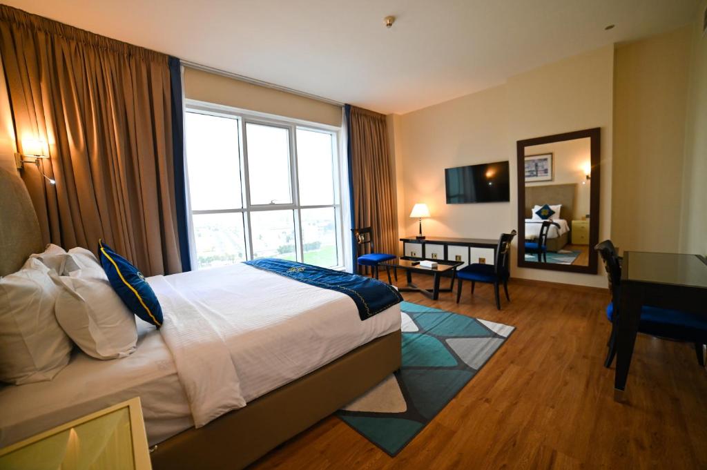 Postel nebo postele na pokoji v ubytování Seven Seas Hotel