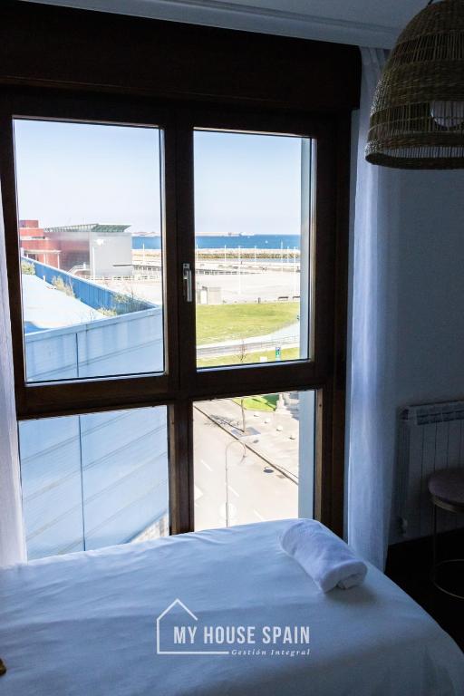 Postel nebo postele na pokoji v ubytování MyHouseSpain - Playa de poniente, con vistas al mar y parking gratuito