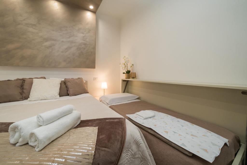 Postel nebo postele na pokoji v ubytování MaisonLuVì