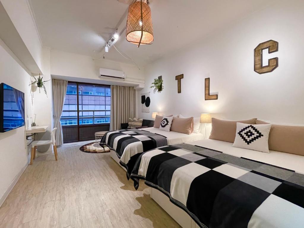 Postel nebo postele na pokoji v ubytování Urban Abode Apartment 1