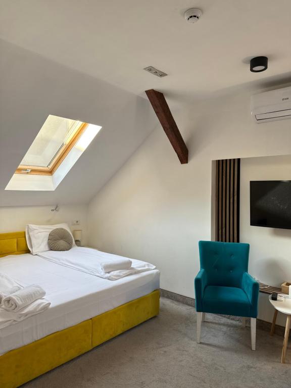 Postel nebo postele na pokoji v ubytování Deluxe Nortel Hotel