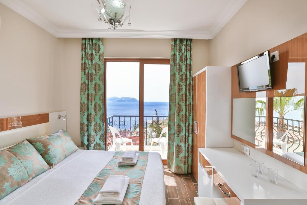 Кровать или кровати в номере Hotel Kayahan