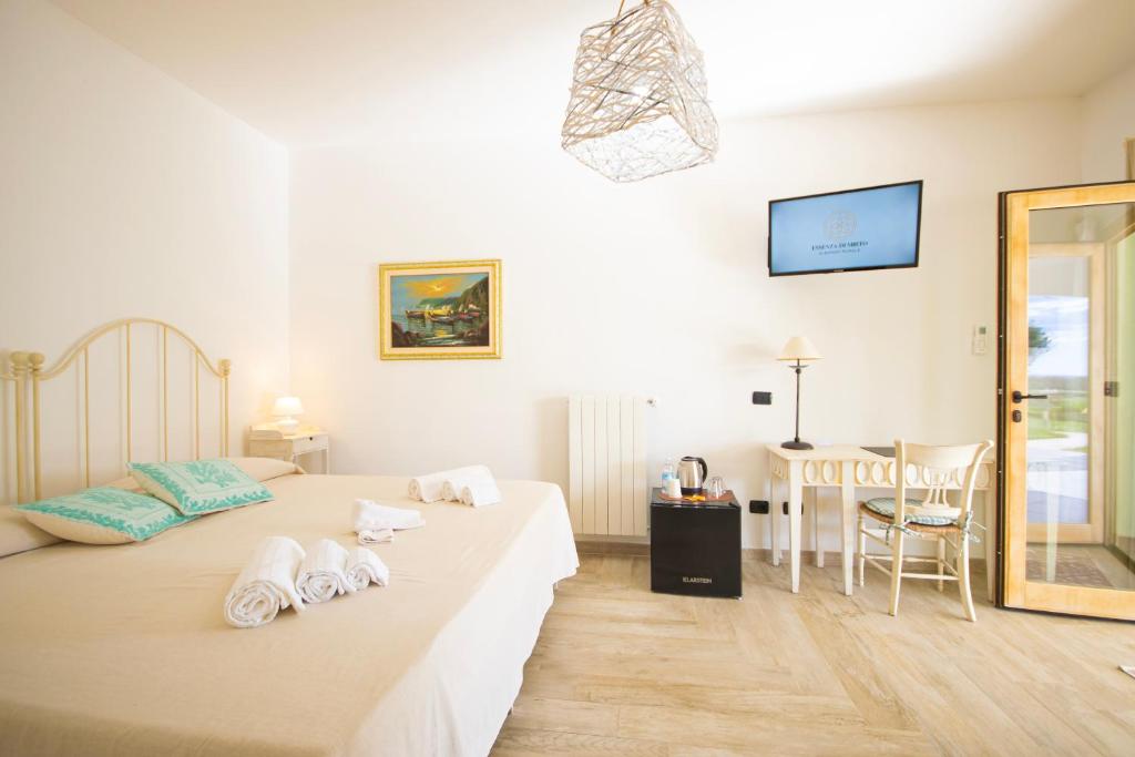 Posteľ alebo postele v izbe v ubytovaní HOTEL Essenza di Mirto
