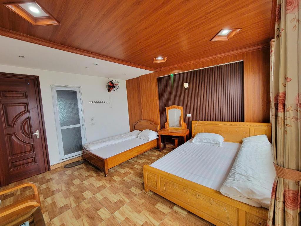 Postel nebo postele na pokoji v ubytování Minh Hưng Hostel