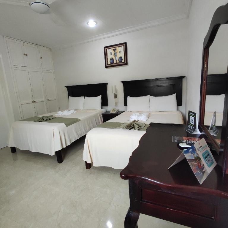Postel nebo postele na pokoji v ubytování Hotel CEO Group