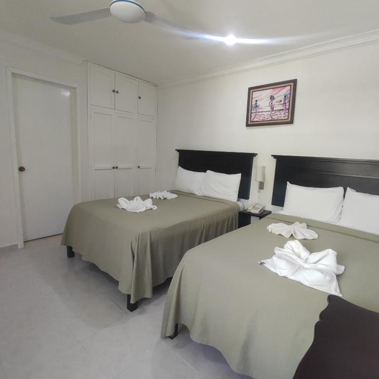 Postel nebo postele na pokoji v ubytování Hotel CEO Group