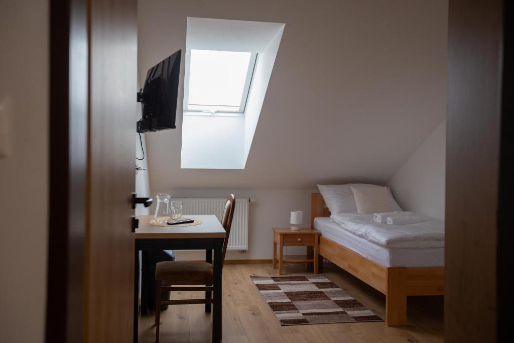 Postel nebo postele na pokoji v ubytování Apartmány Hvezdáreň