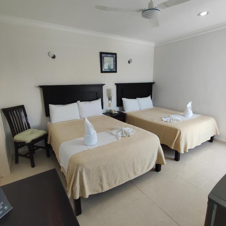 Postel nebo postele na pokoji v ubytování Hotel CEO Group