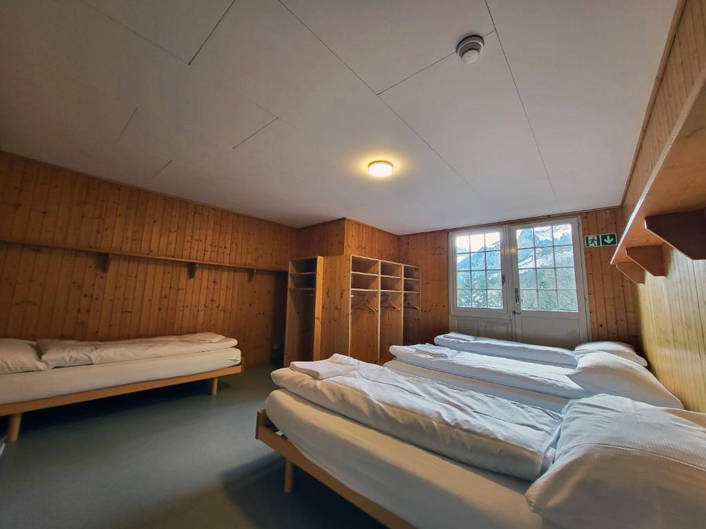 Postel nebo postele na pokoji v ubytování Nordic Arena House