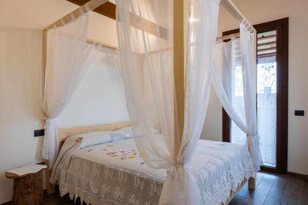 Postel nebo postele na pokoji v ubytování BB Da La Mi Ma, Gradara