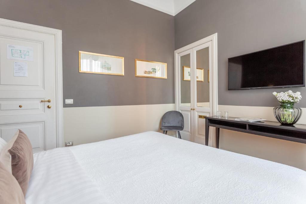 Postel nebo postele na pokoji v ubytování Hotel Parrasio