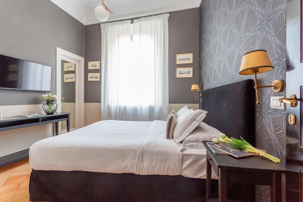 Postel nebo postele na pokoji v ubytování Hotel Parrasio