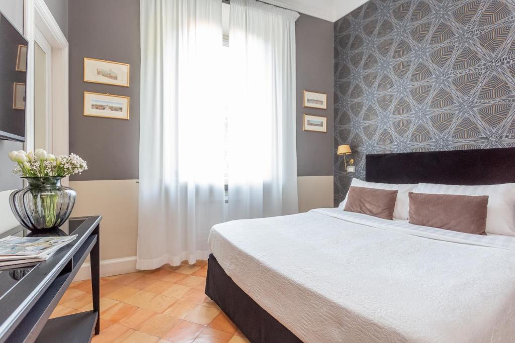 Postel nebo postele na pokoji v ubytování Hotel Parrasio