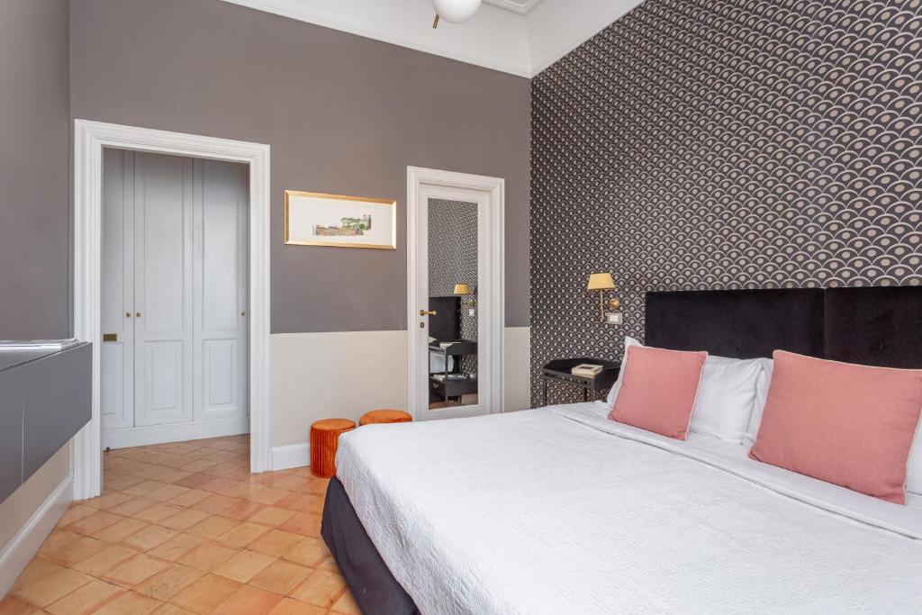 Postel nebo postele na pokoji v ubytování Hotel Parrasio