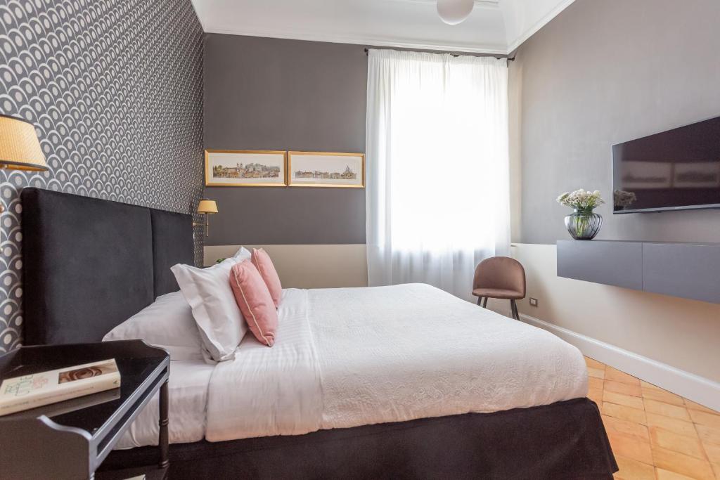 Postel nebo postele na pokoji v ubytování Hotel Parrasio